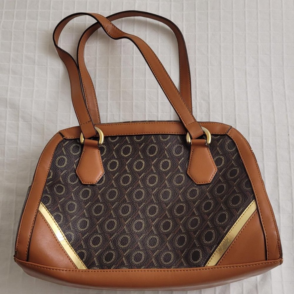 XOXO brown plastic makeup travel bag.